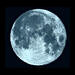 Blue moon on black background